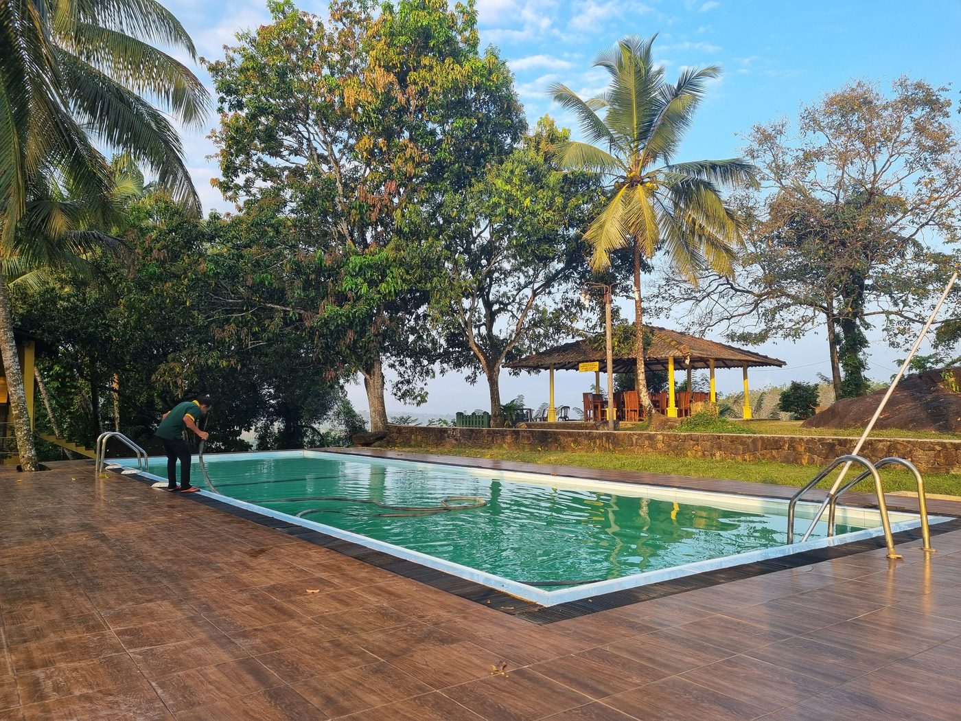 Poolside timber terrace with loungers